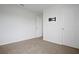 Neutral bedroom featuring carpeted floors and light-colored walls with tv mount at 137 Piave St, Haines City, FL 33844