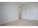 Bedroom featuring neutral carpet, a closet, and a white painted door at 137 Piave St, Haines City, FL 33844
