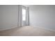 Bedroom featuring neutral carpet, bright light from the window and white curtains at 137 Piave St, Haines City, FL 33844