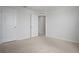 Bedroom featuring neutral carpet, a closet, and a white painted door at 137 Piave St, Haines City, FL 33844