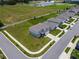Aerial view of a two-story home featuring a well-manicured lawn and gray color scheme at 137 Piave St, Haines City, FL 33844