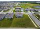 Aerial view of a gray two-story home showcasing the property's green lawn at 137 Piave St, Haines City, FL 33844