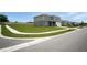 Street view of a modern two-story home with well-kept lawn and sidewalk at 137 Piave St, Haines City, FL 33844
