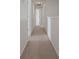 Hallway featuring neutral colored carpet, and white walls with modern lighting at 137 Piave St, Haines City, FL 33844