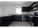 Beautiful kitchen featuring dark cabinets, stainless steel appliances, and modern countertops at 137 Piave St, Haines City, FL 33844