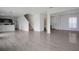 Spacious living room featuring modern flooring, stairs, and an open floor plan to the kitchen at 137 Piave St, Haines City, FL 33844
