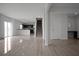 Bright and open living room featuring stairs, modern flooring, and seamless flow to the kitchen at 137 Piave St, Haines City, FL 33844
