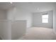 Upstairs loft area filled with natural light from a window overlooking the neighborhood at 137 Piave St, Haines City, FL 33844
