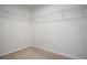 Empty walk-in closet with wire shelving and neutral carpeting at 137 Piave St, Haines City, FL 33844