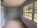 Small bedroom with a window and light-blue walls at 1506 Fairbanks St, Lakeland, FL 33805