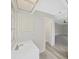 Bright bathroom with a modern vanity and sink, and entry to the large bedroom at 1548 Longbow Dr, Lakeland, FL 33810