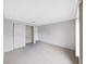 A bedroom features neutral carpet, light gray walls, and a built-in closet, offering versatility for decor at 1548 Longbow Dr, Lakeland, FL 33810