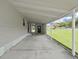 Spacious carport offering covered parking and access to the home's side entrance at 1548 Longbow Dr, Lakeland, FL 33810