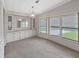 Bright dining room featuring built in cabinets, large mirror, and natural light at 1548 Longbow Dr, Lakeland, FL 33810