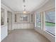 Bright dining room with ample windows and built in cabinets at 1548 Longbow Dr, Lakeland, FL 33810