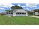Charming single-story home with a well-manicured lawn and covered parking at 1548 Longbow Dr, Lakeland, FL 33810