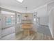 Charming eat-in kitchen with wood counter, white cabinets, and pendant lighting at 1548 Longbow Dr, Lakeland, FL 33810