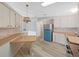Bright kitchen with wood countertops, white cabinets and unique light fixture at 1548 Longbow Dr, Lakeland, FL 33810