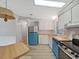 Bright kitchen with wood countertops, white cabinets, and updated appliances at 1548 Longbow Dr, Lakeland, FL 33810