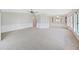 Large, bright living room features neutral decor, ceiling fan, and built-in cabinets at 1548 Longbow Dr, Lakeland, FL 33810