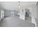 Spacious living room with lots of natural light and access to kitchen at 1548 Longbow Dr, Lakeland, FL 33810
