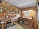 Organize your items in this storage room with ample shelving and a sturdy workbench, perfect for projects at 1548 Longbow Dr, Lakeland, FL 33810