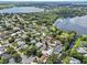 Aerial view of neighborhood, showcasing proximity to lakes and green spaces at 165 Lagoon Rd, Winter Haven, FL 33884