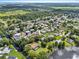Wide aerial shot displaying the property within a community near a serene lake at 165 Lagoon Rd, Winter Haven, FL 33884