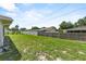 Spacious backyard with lush green grass and a privacy fence, great for outdoor activities and entertaining at 165 Lagoon Rd, Winter Haven, FL 33884
