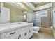 Bathroom featuring vintage fixtures and a tiled shower-tub combo at 165 Lagoon Rd, Winter Haven, FL 33884