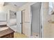 Bathroom featuring a glass-enclosed shower and patterned wallpaper at 165 Lagoon Rd, Winter Haven, FL 33884