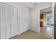Hallway featuring multiple closets with easy access to the kitchen at 165 Lagoon Rd, Winter Haven, FL 33884