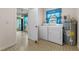 Laundry room equipped with appliances, a water heater, and window at 165 Lagoon Rd, Winter Haven, FL 33884