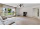 Inviting living room with a large window, cozy sofa, and ample natural light at 165 Lagoon Rd, Winter Haven, FL 33884