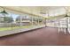 Spacious sunroom with many windows and ceiling fans at 165 Lagoon Rd, Winter Haven, FL 33884