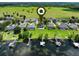 Aerial view showcasing homes with waterfront and private docks, highlighting community and luxurious outdoor living at 1836 Woodpointe Dr, Winter Haven, FL 33884