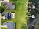 Aerial view of homes with pools and waterfront access with private docks, blending luxury and natural beauty at 1836 Woodpointe Dr, Winter Haven, FL 33884