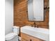 Chic bathroom with rustic wood wall and modern vessel sink vanity at 1836 Woodpointe Dr, Winter Haven, FL 33884