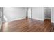 Bright bedroom with hardwood floors, white trim, and neutral walls at 1836 Woodpointe Dr, Winter Haven, FL 33884