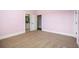 A bedroom featuring neutral carpet, access to another bedroom and a bathroom at 1836 Woodpointe Dr, Winter Haven, FL 33884