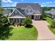 Well maintained home with a beautiful lawn, mature landscaping and brick driveway at 1836 Woodpointe Dr, Winter Haven, FL 33884