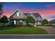 Gorgeous home featuring well manicured lawn, mature landscaping and a brick driveway at 1836 Woodpointe Dr, Winter Haven, FL 33884
