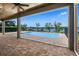 Screened-in pool with waterfront views, perfect for relaxing and entertaining at 1836 Woodpointe Dr, Winter Haven, FL 33884