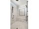 Luxurious walk-in shower with dual shower heads and decorative tile work at 1836 Woodpointe Dr, Winter Haven, FL 33884