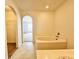 Bright bathroom featuring a vanity, mirror, bathtub, and sink at 1844 Emily Dr, Winter Haven, FL 33884