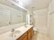 Functional bathroom with a double sink vanity, large mirror, and a shower-tub combination at 1844 Emily Dr, Winter Haven, FL 33884