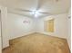 Bedroom featuring ceiling fan and window with plywood and blinds at 1844 Emily Dr, Winter Haven, FL 33884
