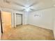 Bedroom featuring ceiling fan, closet, and a connecting doorway to another room at 1844 Emily Dr, Winter Haven, FL 33884