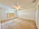 Bedroom featuring ceiling fan and window with plywood and blinds at 1844 Emily Dr, Winter Haven, FL 33884