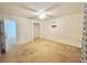Bright bedroom with a ceiling fan, closet, and a connecting doorway to another room at 1844 Emily Dr, Winter Haven, FL 33884